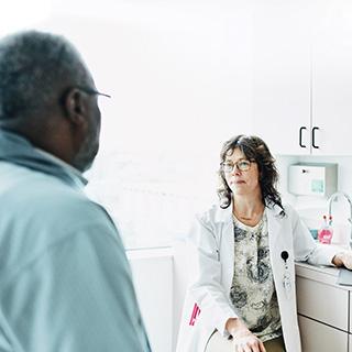 Man talking to his doctor.